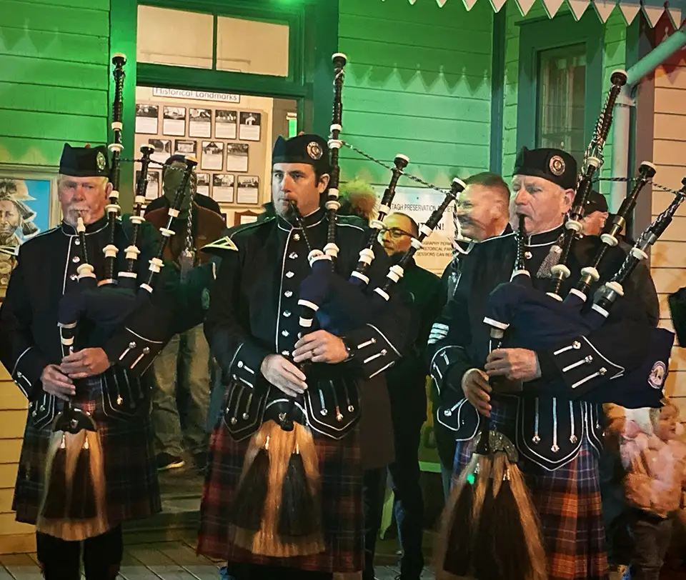 3 bagpipers playing